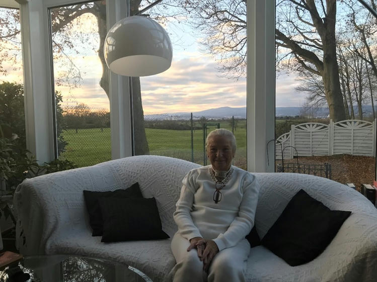 life-with-a-tracheostomy An interview with Mrs. Edeltraud Stegemann sitting in a white couch with beautiful view behind