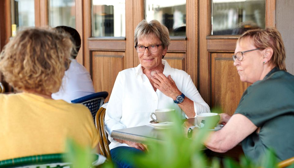 Women sitting an talking.