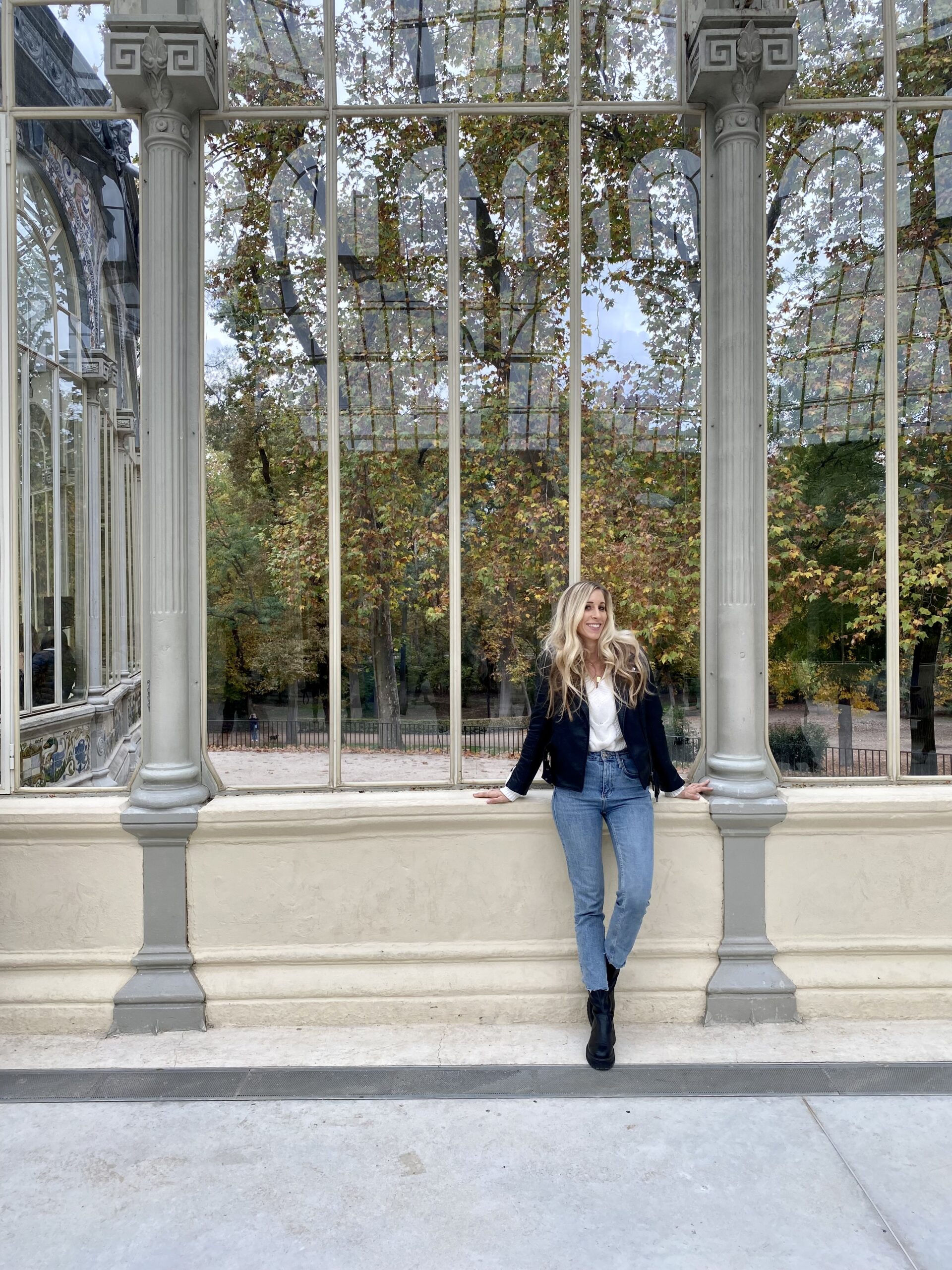 A woman standing in front of a cultural building