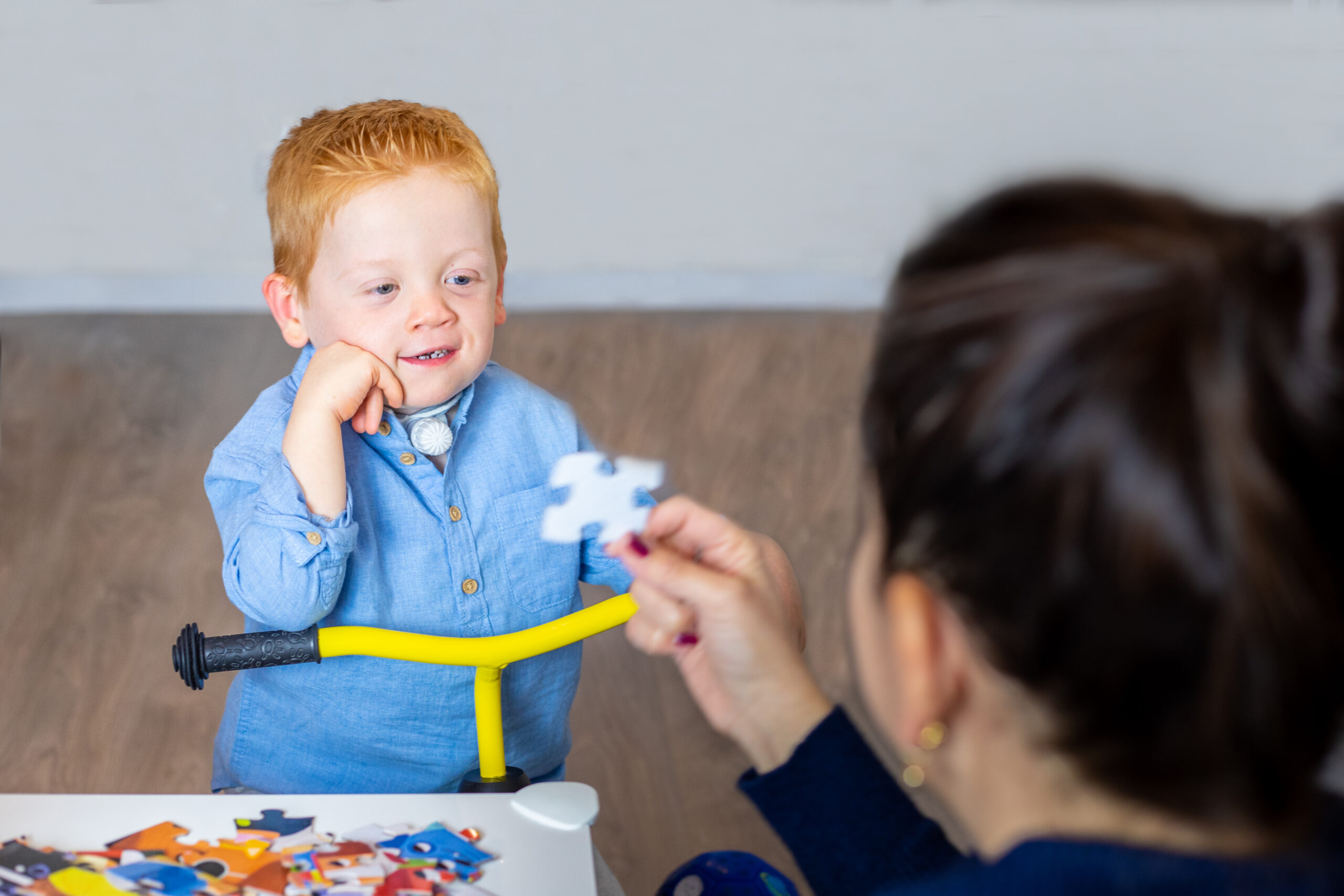pediatric-tracheostomy-child-plays-with-puzzles